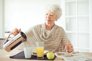 Elderly woman having a healthy breakfast