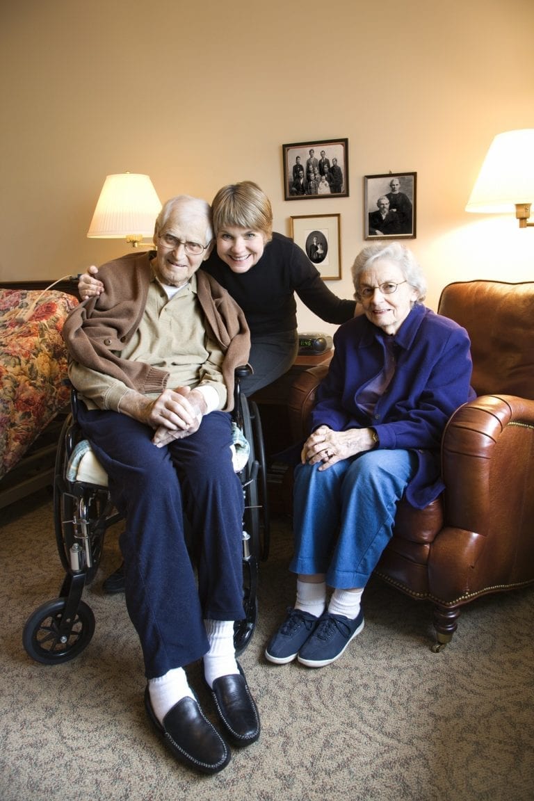 Caucasian middle-aged daughter with elderly parents in retiremen
