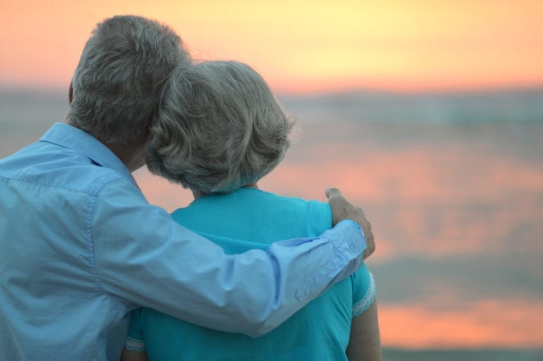 Elderly couple at sunset