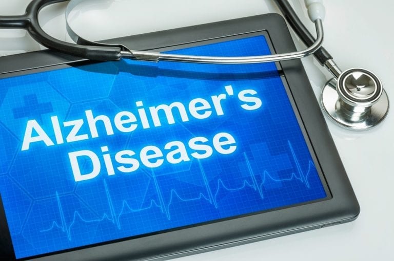 Tablet with the diagnosis alzheimer's disease on the display
