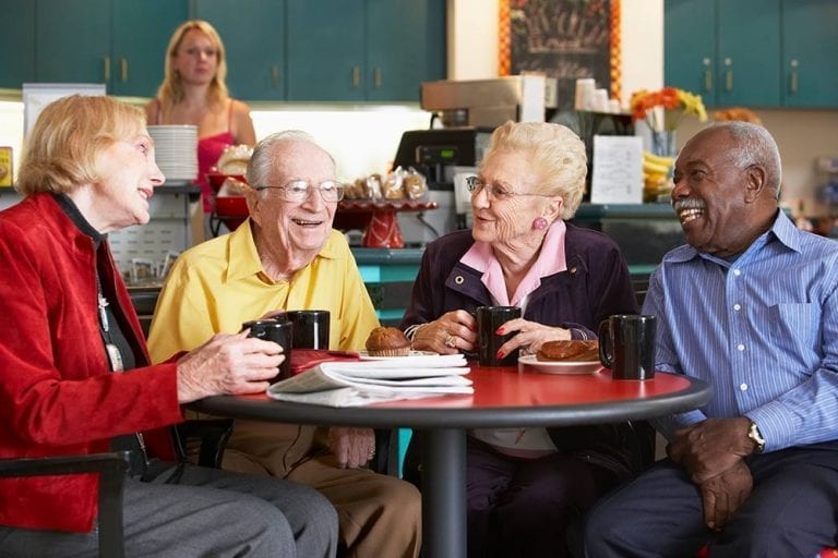 Elderly group enjoying coffee