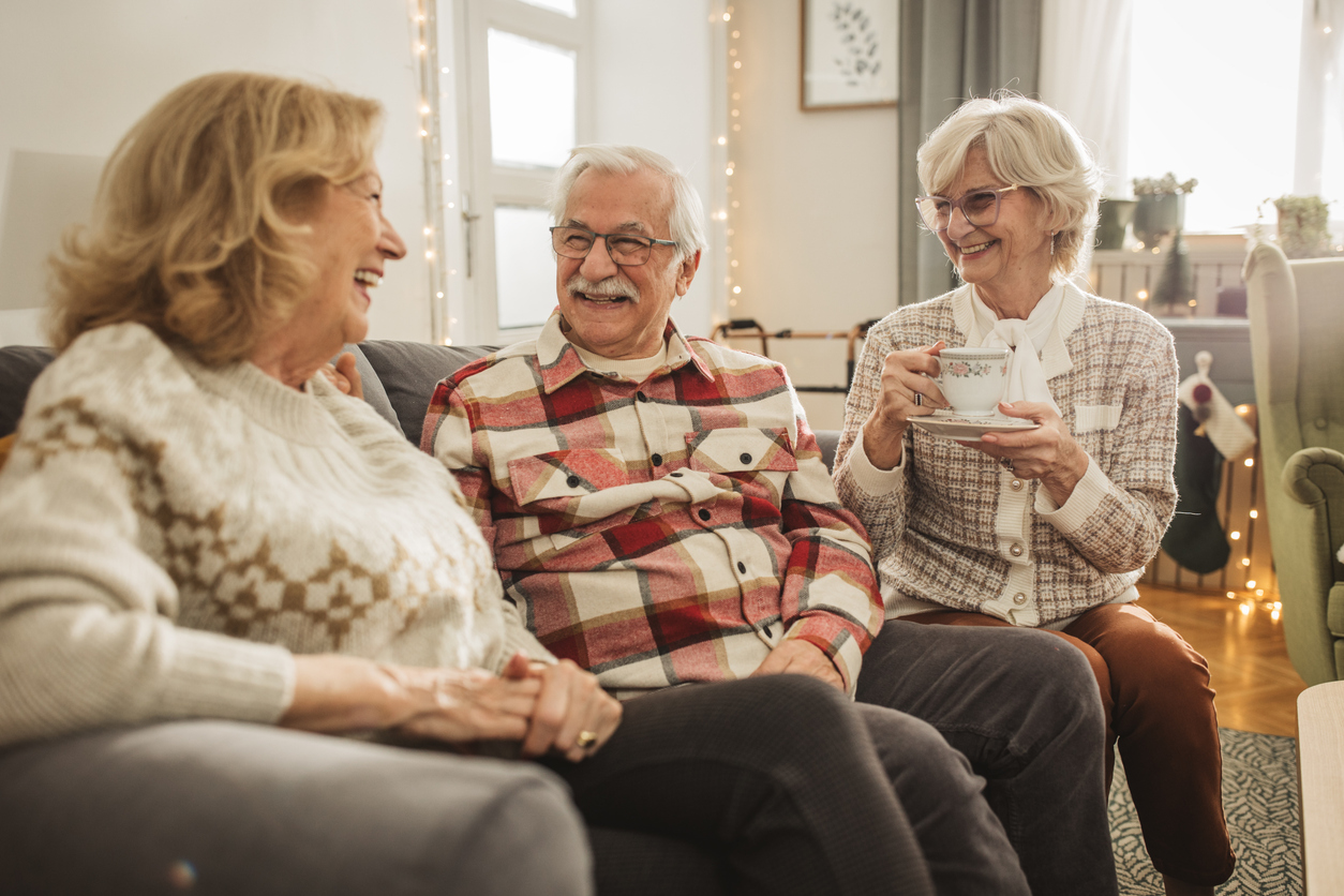 Senior friends smiling together during conversation
